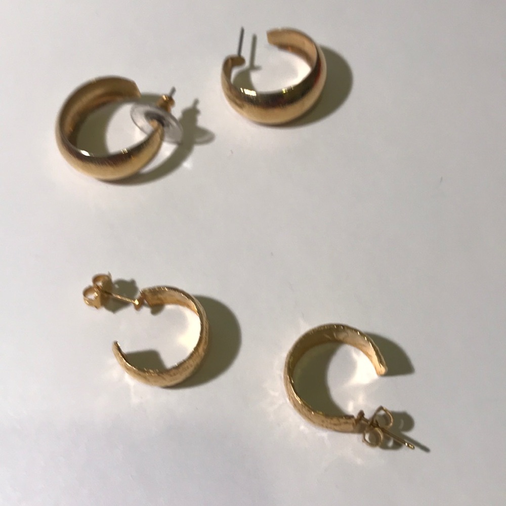 Two pairs of gold tone hoop pierced earrings